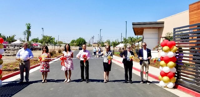 Ribbon cutting ceremony for new building with longtime Nexsys client
