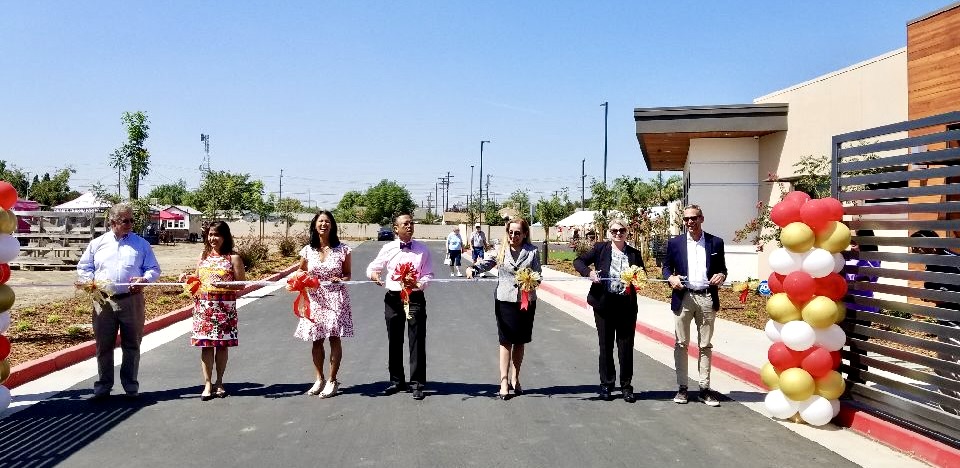 Ribbon cutting ceremony for new building with longtime Nexsys client